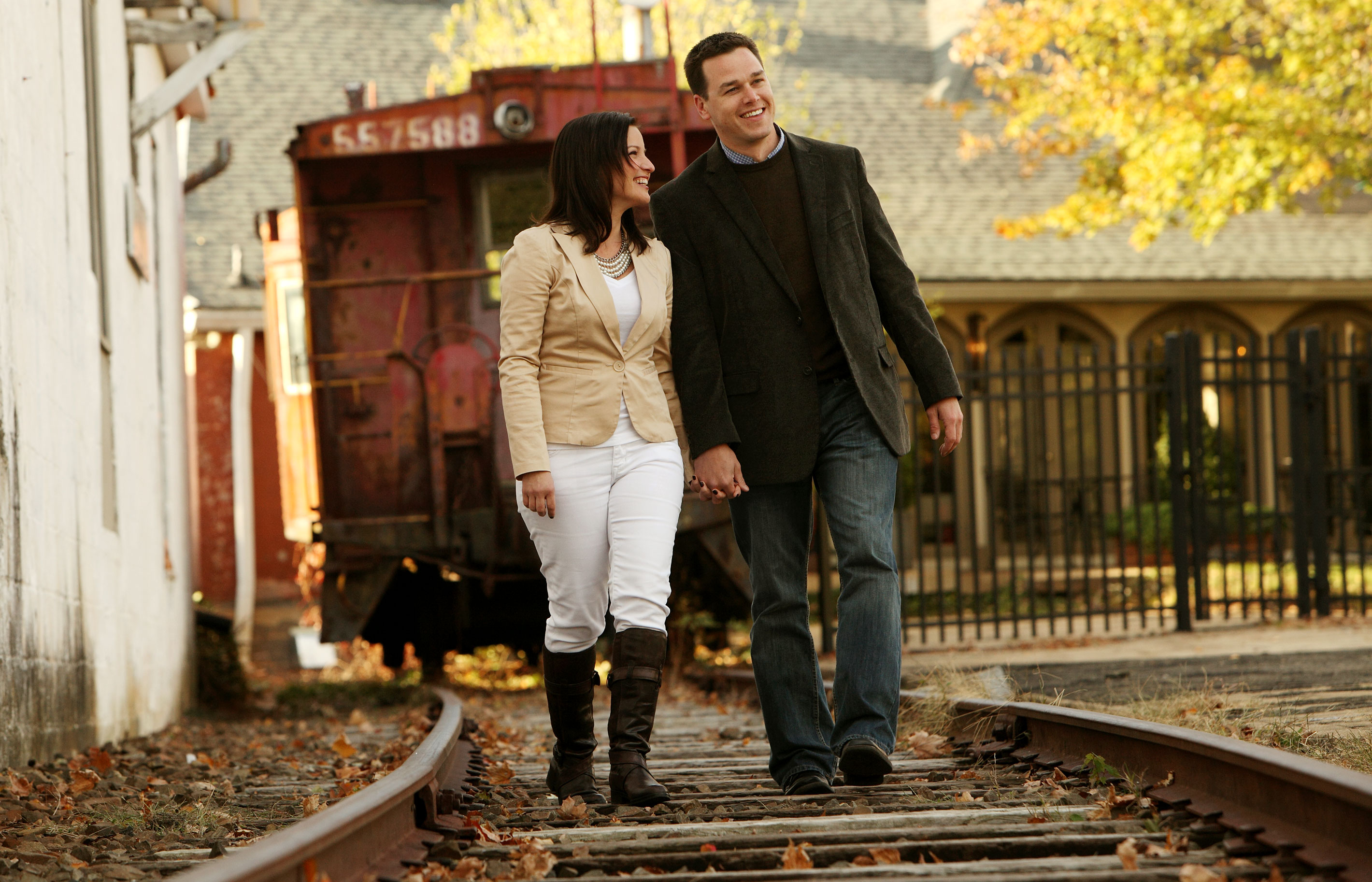 Outdoor engagement portrait on railroad tracks in Warrenton, Virginia.