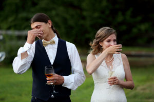 Bride and groom cry during the wedding toast during their outdoor wedding in Warrenton, Virginia.