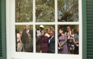 wedding guests reflected in window